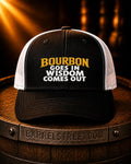 A black and white trucker cap with the text 'BOURBON GOES IN WISDOM COMES OUT' in yellow and white on the front, displayed on a wooden barrel with a Barrelstreet.com logo.