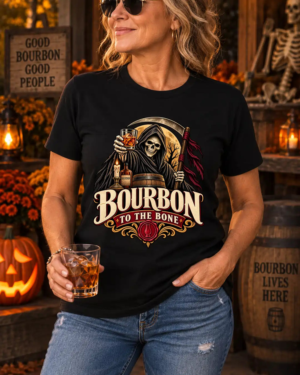 Model wearing a black Bourbon to the Bone T-shirt with a Grim Reaper and bourbon glass graphic