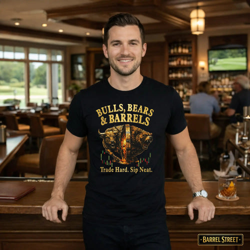Man wearing a black t-shirt with 'Bulls, Bears & Barrels' design in a bar setting