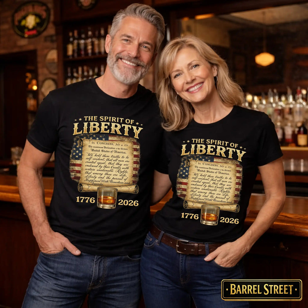 Man and woman wearing 'The Spirit of Liberty' t-shirts in a bar setting.