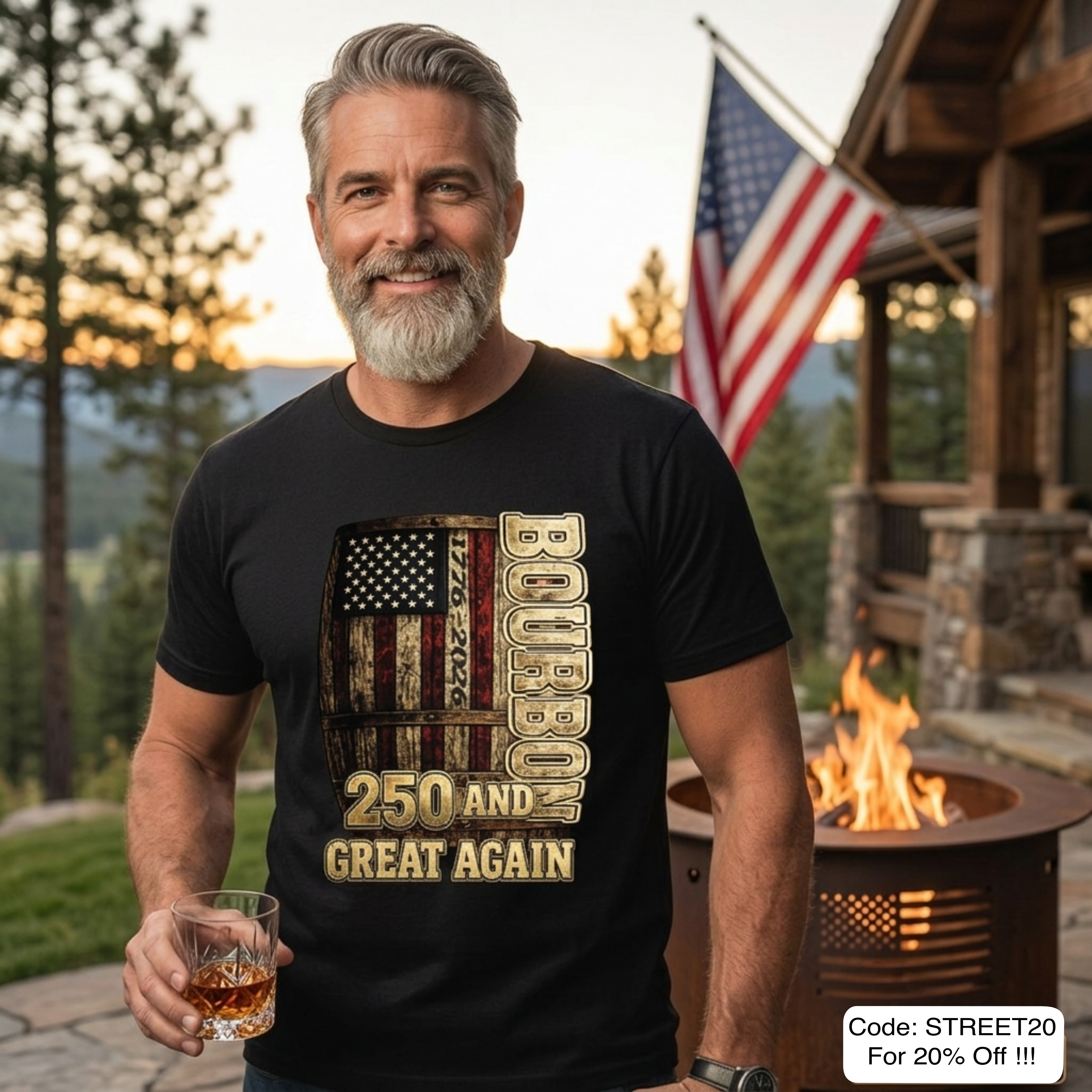 Man wearing a black t-shirt with a graphic design, holding a drink outdoors with a sunset and American flag in the background.