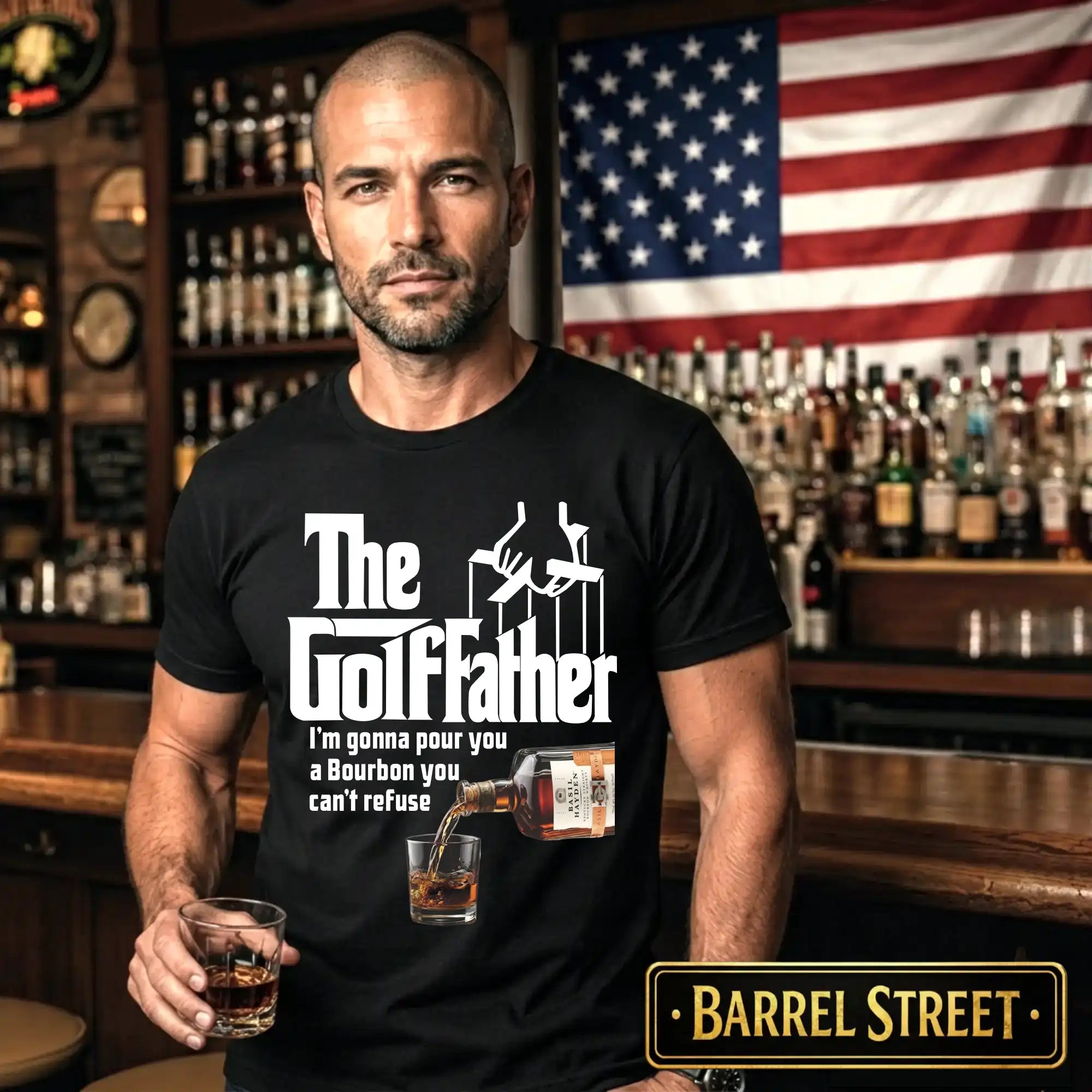 Man wearing a black t-shirt with 'The Golffather' design in a bar setting with an American flag in the background.