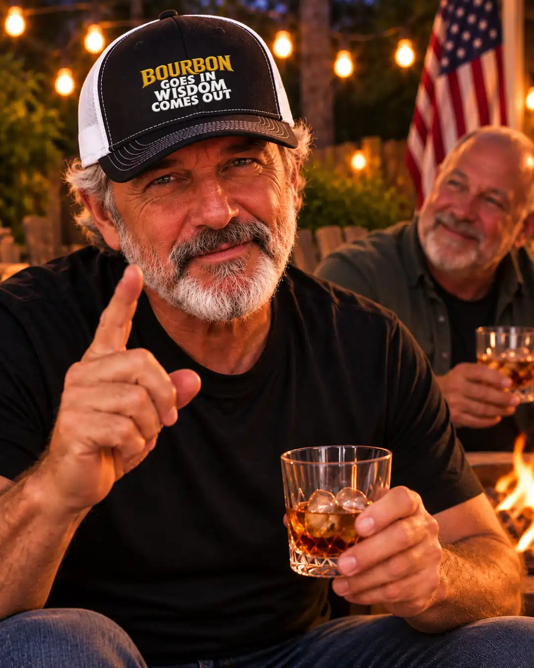 A black and white trucker cap with the text 'BOURBON GOES IN WISDOM COMES OUT' in yellow and white on the front