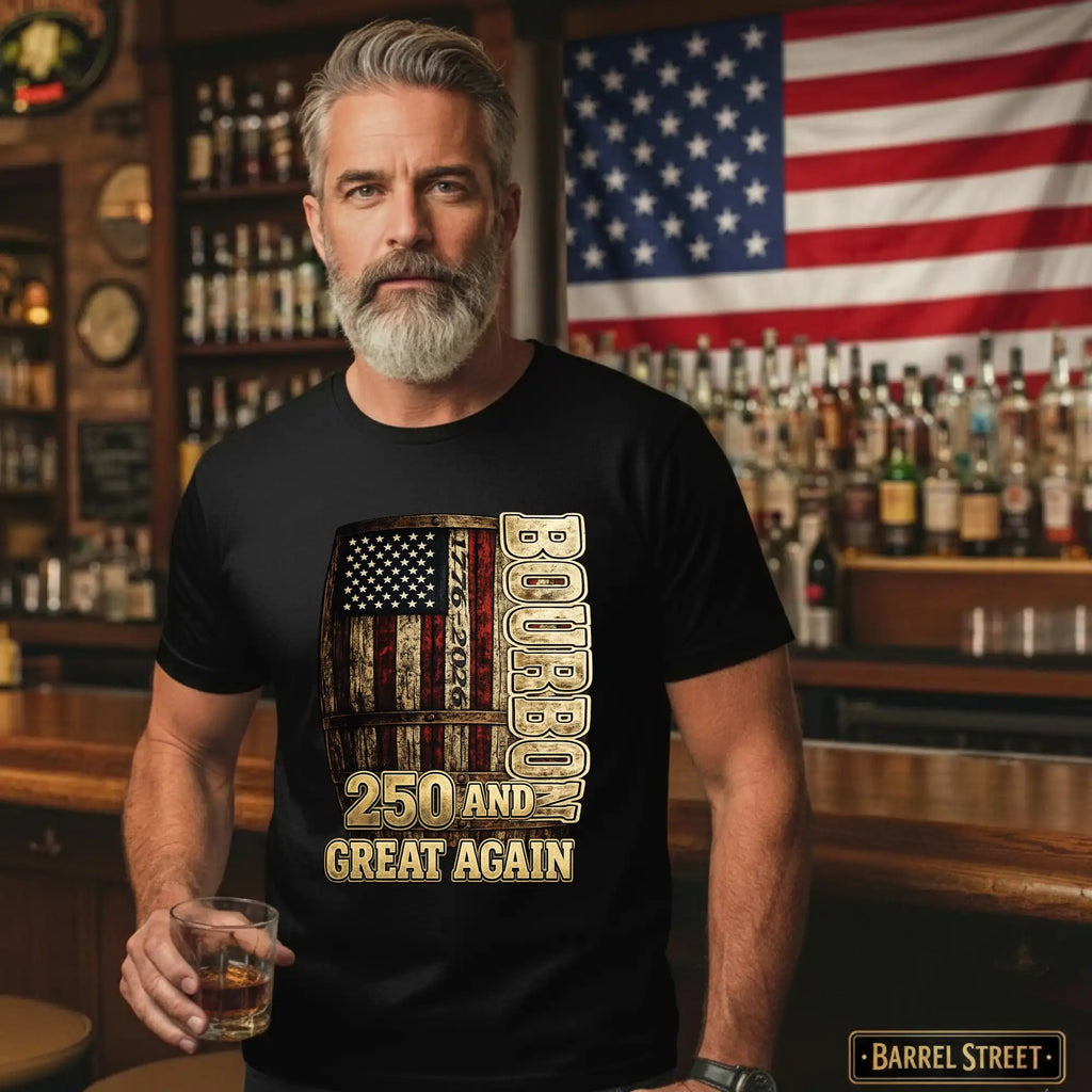 Man wearing a black t-shirt with a barrel design and text in a bar setting with an American flag in the background.